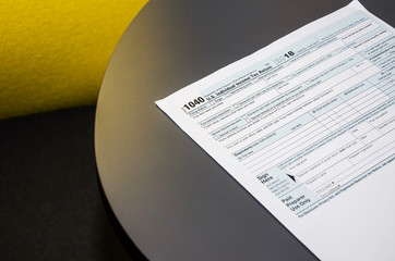 tax form 1040 on a gray table in the office