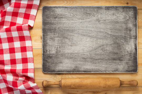 cloth napkin and cutting board at rustic wooden  background