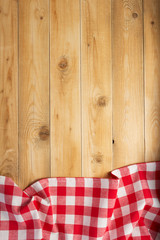 cloth napkin at rustic wooden background, top view