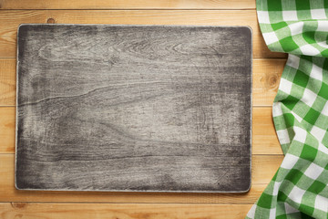 cloth napkin at rustic wooden background, top view