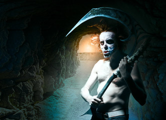 Portrait of evil grim reaper with scythe in tunnel to hell
