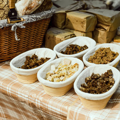 Bakery counter at the craft market with baskets of diced bread for tasting.