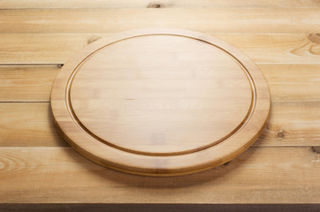 pizza cutting board at rustic wooden table