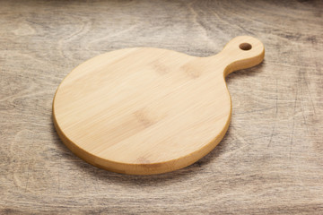 cutting board on wooden  table background