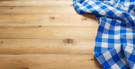 cloth napkin at rustic table in front,