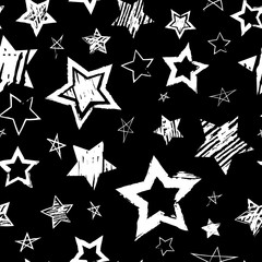 Abstract seamless grunge urban pattern with hand drawn white stars on black background. Grungy repeating backdrop for kids, sport textile, clothes, bedding, wrapping paper. Shabby textured wallpaper.  - 282384460
