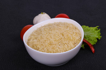Raw uncooked rice in the bowl
