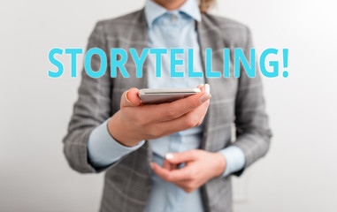 Word writing text Storytelling. Business photo showcasing activity writing stories for publishing them to public Business concept with mobile phone and business woman