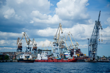 Fototapeta premium cargo cranes for unloading ships in the port