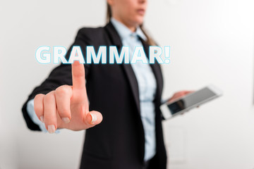 Conceptual hand writing showing Grammar. Concept meaning whole system structure language syntax and morphology Digital business in black suite concept with business woman