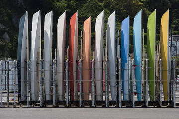Obraz premium Small sailboats lining the marina's boat yard