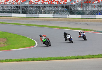 Motorcycle racers on the race track