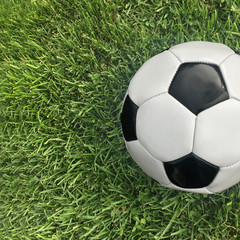 Fototapeta na wymiar Football for soccer on grass