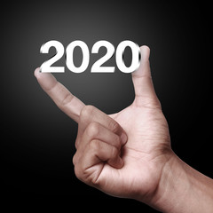 Year 2020 with hand.