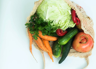 Ugly vegetables in a string bag isolated