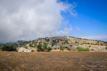 Ai-petri mountain in the fog. High mountain. Crimea. Russian mountains. Low clouds. Beautiful mountain landscape. The famous AI Petri mountain, partially covered with clouds, fog