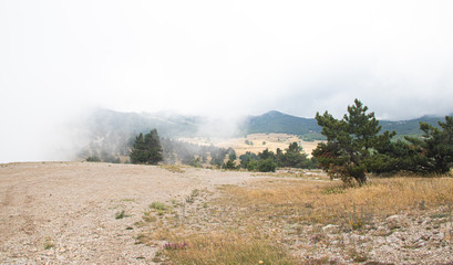 Ai-petri mountain in the fog. High mountain. Crimea. Russian mountains. Low clouds. Beautiful mountain landscape. The famous AI Petri mountain, partially covered with clouds, fog