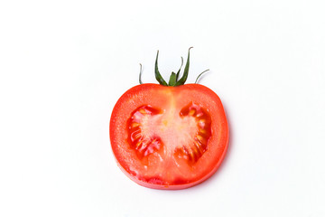 Slice of ripe red tomato on white isolate background.