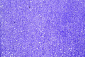 Texture of an old painted wall of purple color closeup. Abstract background