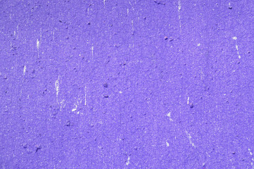 Texture of an old painted wall of purple color closeup. Abstract background