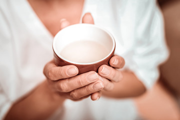 Cup of fragrant herbal tea before drinking.