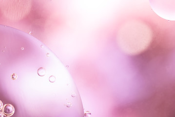 Pink airy bubbles and glowing drops