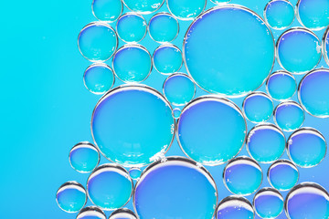 Clear air bubbles on azure background