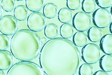 Transparent air bubbles in liquid on multicolored background