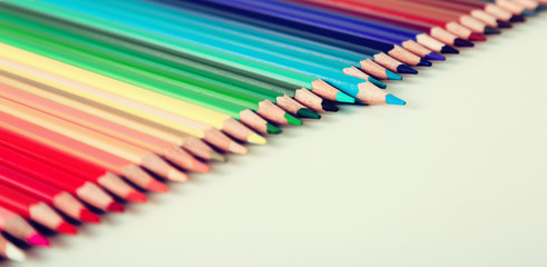 colored pencils lying in row