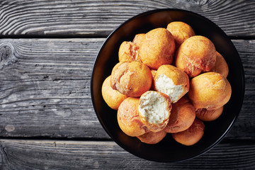 Caribbean Fried balls in a black bowl