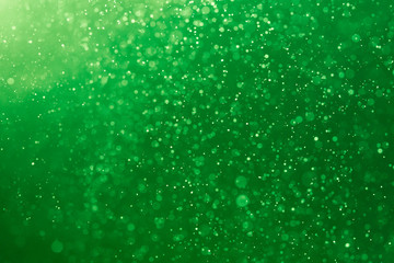 Abstract Green bokeh defocus glitter blur Background.