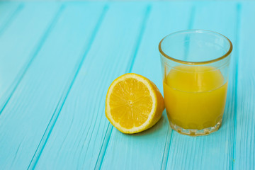 glass of orange juice with slice of lemon