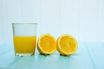 glass of orange juice with slice of lemon
