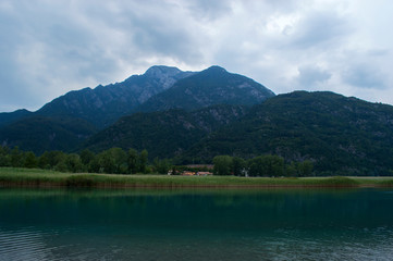 Fototapeta na wymiar Mountain lake on the background of the Alps