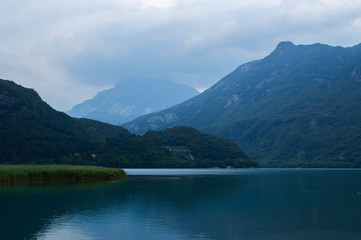 Fototapeta na wymiar Mountain lake on the background of the Alps
