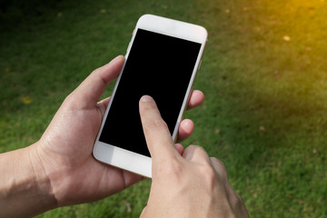 Hand holding Smart phone with blank screen.