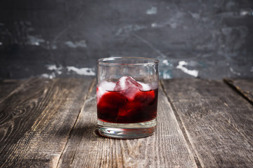Old fashioned cherry cocktail with berries. Selective focus. Shallow depth of field. 