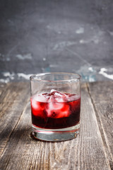 Old fashioned cherry cocktail with berries. Selective focus. Shallow depth of field. 