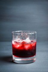 Old fashioned cherry cocktail with berries. Selective focus. Shallow depth of field. 