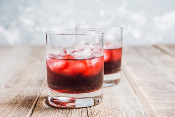 Old fashioned cherry cocktail with berries. Selective focus. Shallow depth of field. 