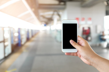 Hand holding Smart phone with blank screen.