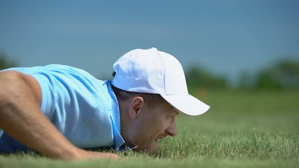 Tricky man blowing golf ball in hole, agility and cunning success strategy hobby