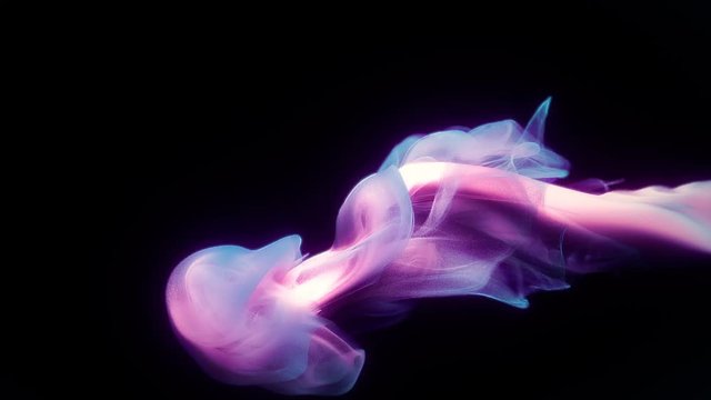 Purple pink color paint ink drops in water slow motion art background with copy space. Inky cloud swirling flowing underwater. Abstract smoke explosion animation isolated on black alpha channel