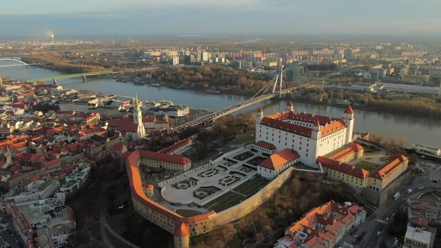 Aerial: Bratislava Cityscape with Castle and Gardens and Danube River, in Slovakia