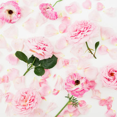 Floral pattern with pink roses flowers and petals on white background. Flat lay, Top view.