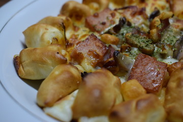 Cheese Meat Italian Pizza On Plate With Wooden Table In The Background