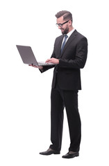 in full growth. businessman with open laptop.