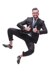 in full growth. happy dancing young businessman