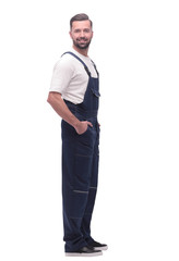 side view. smiling man in overalls looking forward to copy space