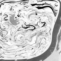 Abstract monochrome marble texture. Paper and mix of flowing ink.